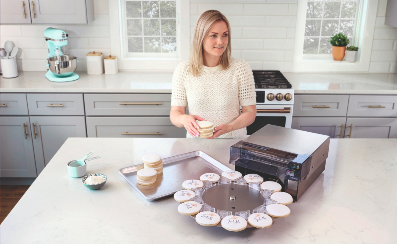 lady making iced biscuits using Eddie the edible ink printer