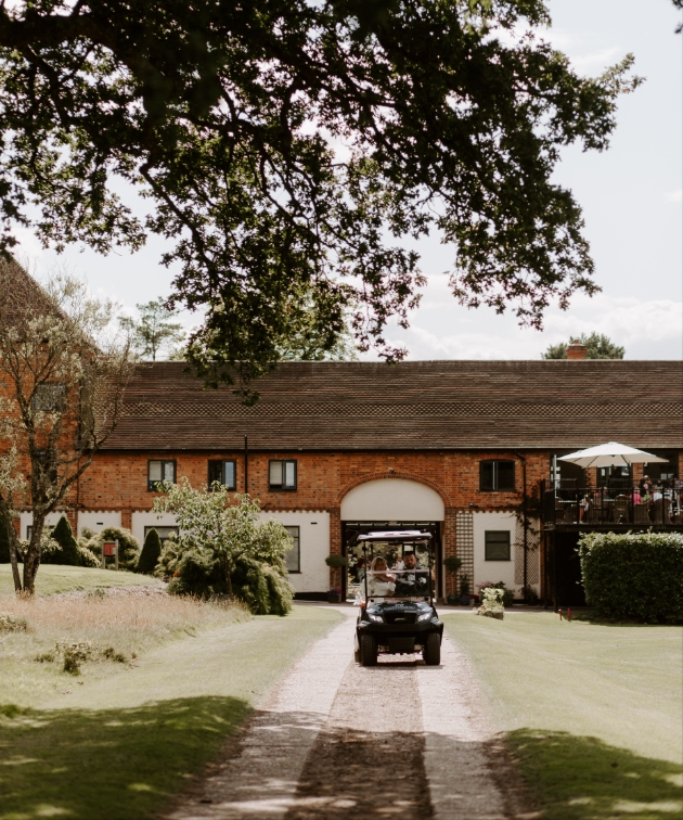 Cottesmore Hotel Golf & Country Club bride and groom on golf buggy