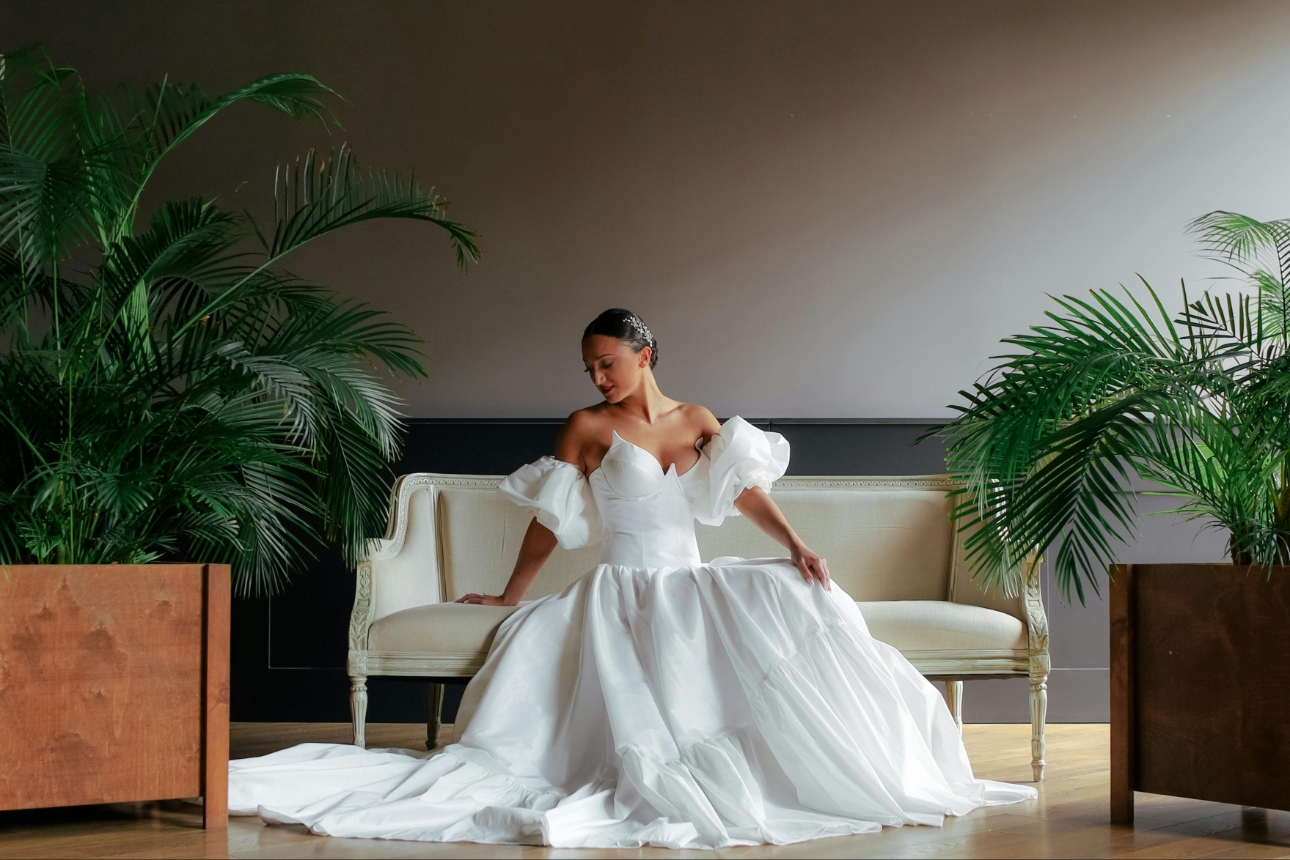 white wedding dress with bride on chair