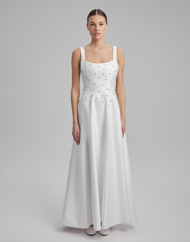 model in simple princess gown with scattered pearls on bodice 