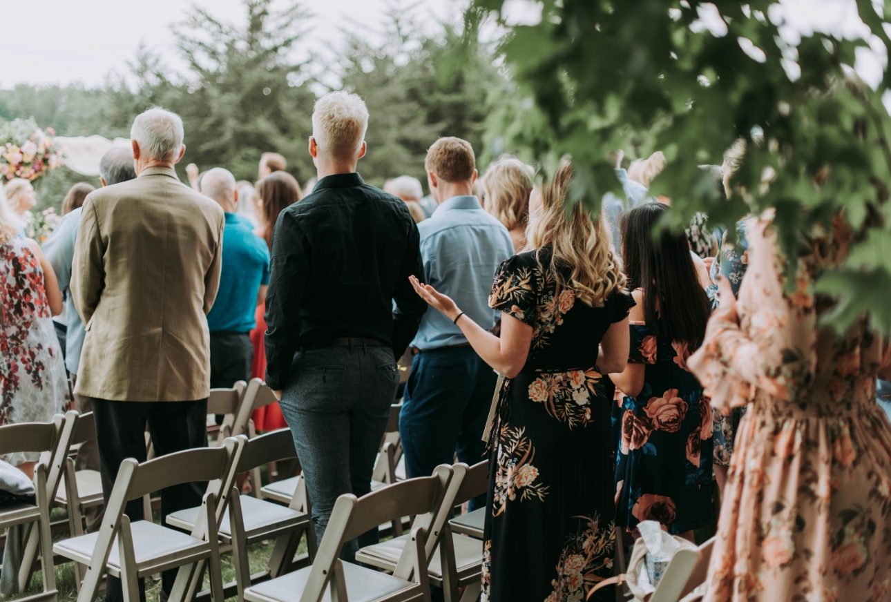 guests at an outdoor wedding ceremony