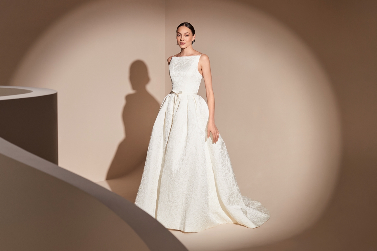 crafted from soft ivory jacquard and features a high square-neck corset finished with micro spaghetti straps. 